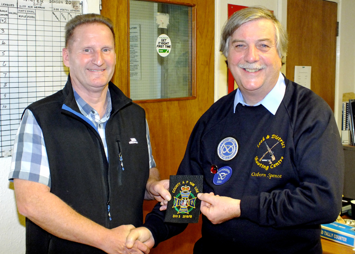 Photograph shows Osborn Spence - SSRA Airgun Secretary (pictured right) presenting the NSRA (680) Inter-County Air Pistol League - Division 3 - 2018/2019 - Winners Blazer Badge
