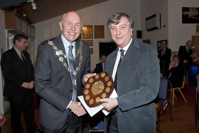 Photograph (Copyright Angela Lilley Photography, Leek) shows the Mayor of Leek - Councillor John Fisher (pictured left) presenting the 'Coach of the Year' Trophy to Leek and District Shooting Centre Secretary - Mr Osborn Spence (pictured right).