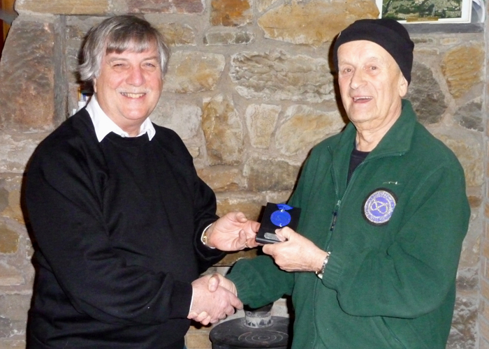 Photograph shows Osborn Spence - SSRA Airgun Secretary (pictured left) presenting the SSRA Individual Air Rifle 'B' League - Winter 2019/2020 - 2nd Place Medal to Alf Whiston of Leek and District Shooting Centre (pictured right).