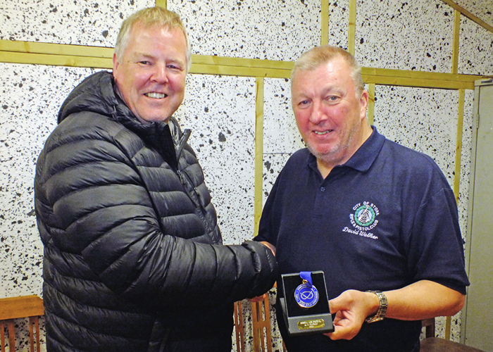 Photograph shows Dom Paskin of City of Stoke RPC (pictured left) receiving his SSRA Individual Air Pistol League - 1st Place Medal from David Walker of City of Stoke RPC (pictured right).