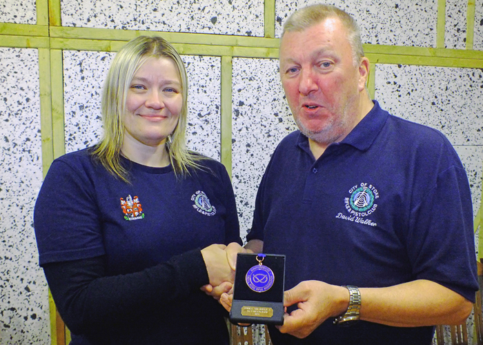 Photograph shows Steph Reynolds of City of Stoke RPC (pictured left) receiving her SSRA Individual Air Rifle "A" League - 3rd Place Medal from David Walker of City of Stoke RPC (pictured right).