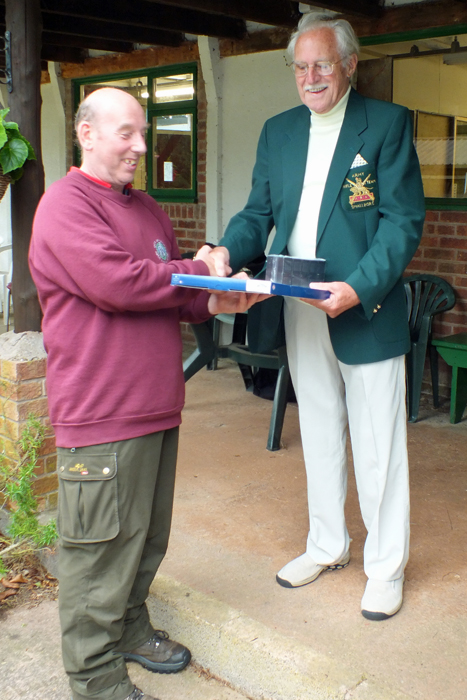 Photograph shows B. Parker (pictured left) receiving the Class 'D' First Place Prize from SSRA President, Major (Retired) Peter Martin, MBE (pictured right).