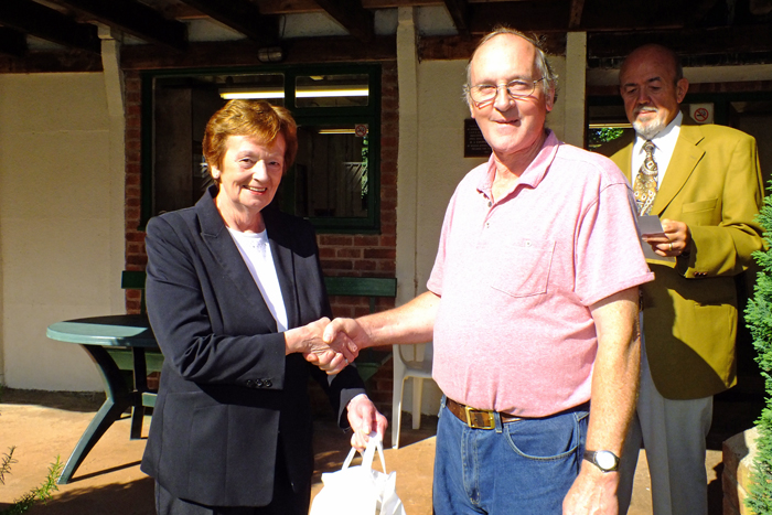 Photograph shows Mary Jennings, pictured left, presenting the Class B 3rd Place Prize to Gordon Abbots, pictured right.