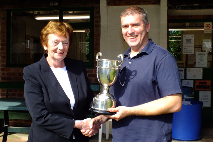 Photograph shows Mary Jennings, pictured left, presenting the R.W. De Nicolas Memorial Trophy to Stuart Powell, pictured right.