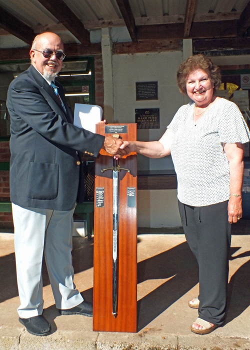 Photograph shows Mrs. Janet Troke (pictured right), presenting the Wilkinson Sword to SSRA Chairman Richard Tilstone (pictured left).