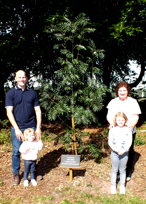 Phe above photograph shows Martin Troke (pictured left) and Janet Troke (pictured right), with Martin's young children, standing alongside the Rowan Tree which was planted within the Chipperfield Ranges Complex, and the memorial plaque dedicated to Fred Troke.