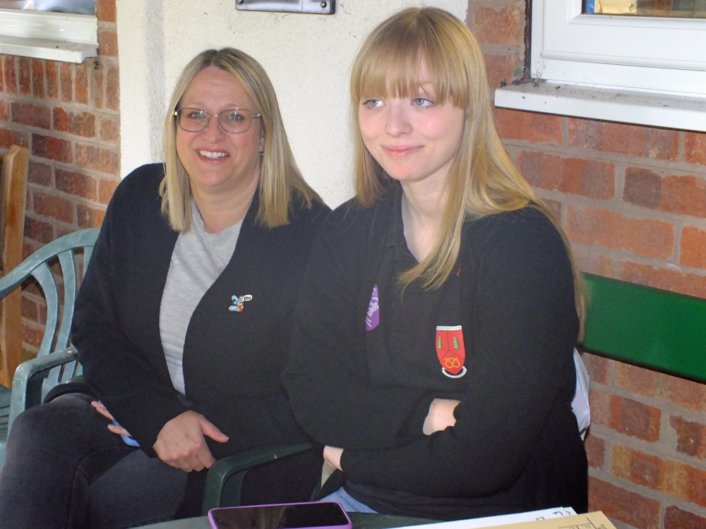 Photograph shows Emma Houghton (pictured left) and Phoebe Houghton (pictured right) sharing a quiet moment together.