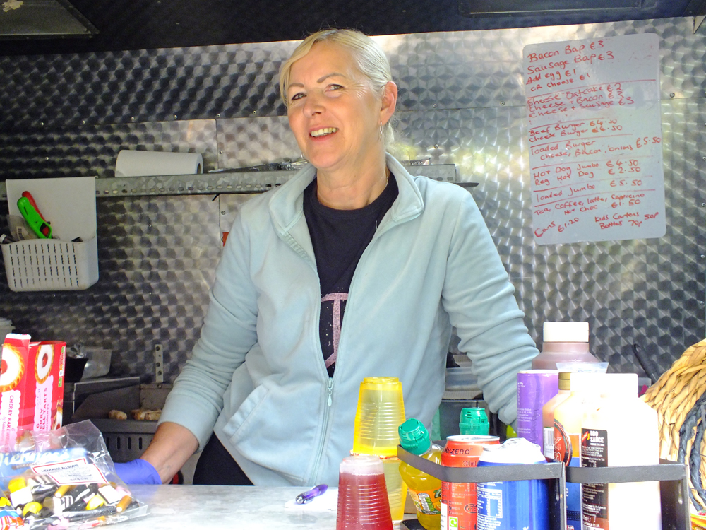 Photograph shows Sandra Williams, proprietor of San's Funky Kitchen, ready and willing to welcome hungry customers to enjoy the variety of very tempting food on offer.