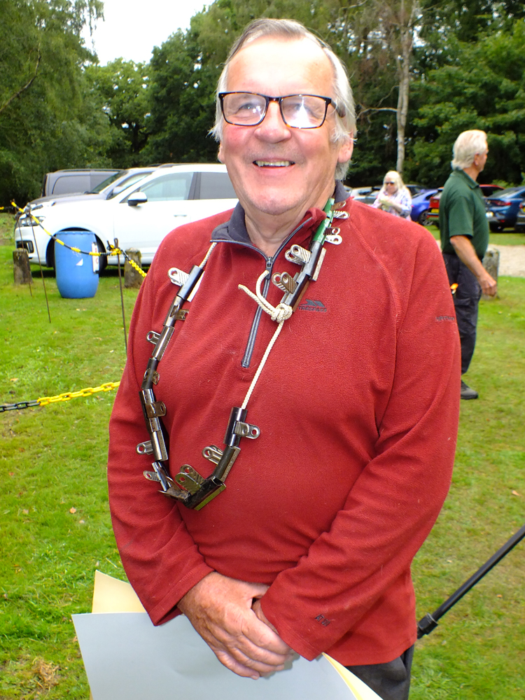 Photograph shows Ian Abbotts calmly preparing to wander down the range to set-up his next set of targets. Don't just love those bulldog clips!