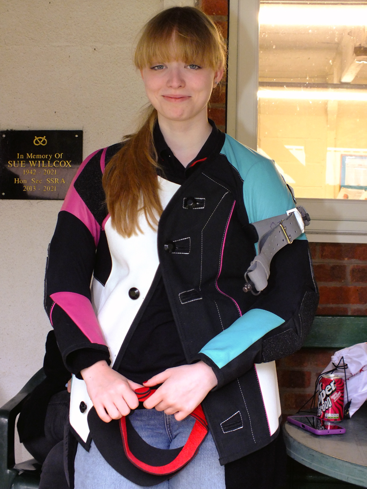 Photograph shows Phoebe Houghton, waiting patiently on the verandah, in readiness for her opportunity to take on the challenge ahead.