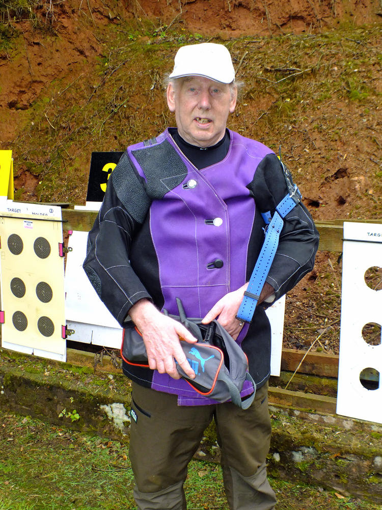 Photograph shows Brian Parker ready to affix his targets before heading off back to the firing line.