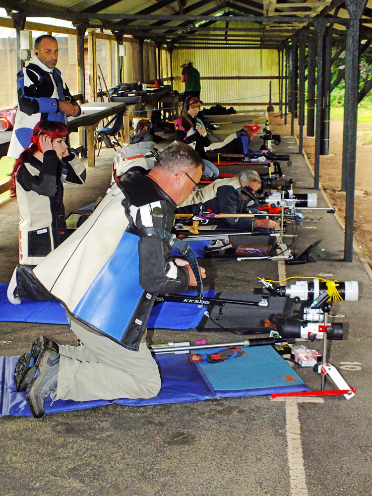 Photograph shows the last minute adjustments being made by the competitors on the firing line, before the commencement of the next detail.