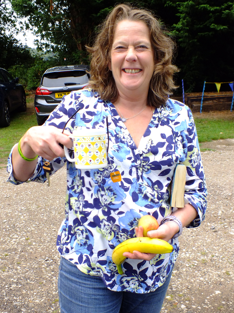 Photograph shows Dawn Hunt about to enjoy a very welcome break. After all, everything stops for tea ... and an apple ... and a banana ... and a good book!