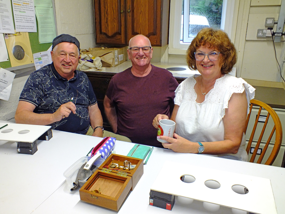 The above photograph shows members of the official scoring team - John Wilshaw (pictured left), Jeff Hickson (pictured centre), and Judith Simcock (pictured right) - taking a much needed break after meticulously scrutinising a plethora of targets throughout the morning session. Well done!