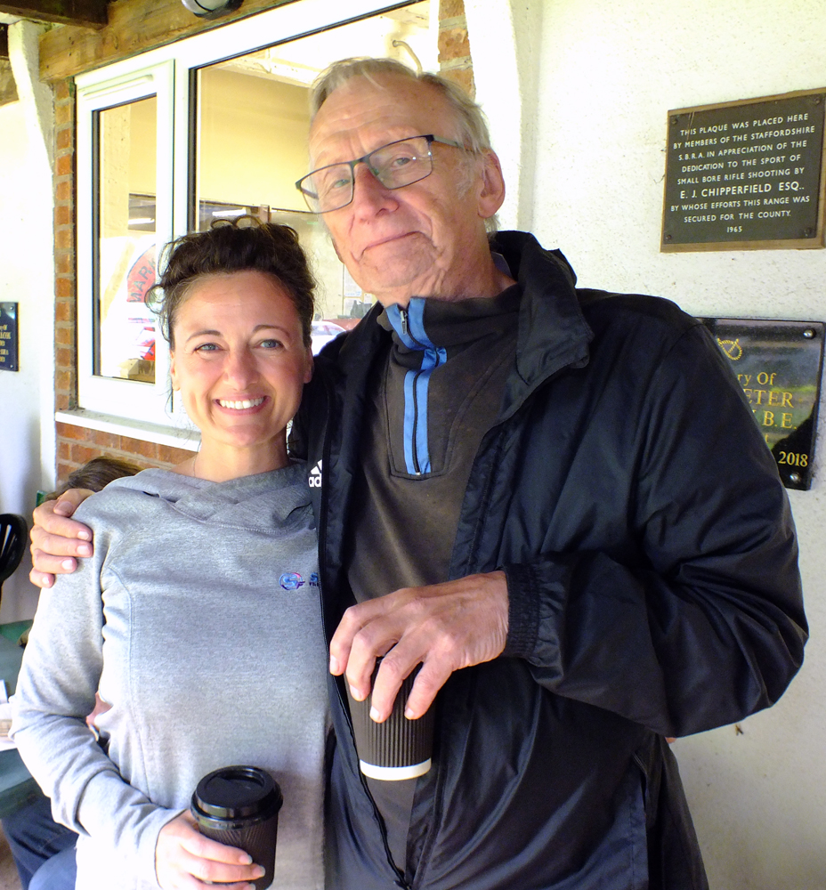 Photograph shows Natasha Minikin (pictured left) and Vic Tyne (pictured right) sheltering from the elements, enjoying a warm brew and a natter.