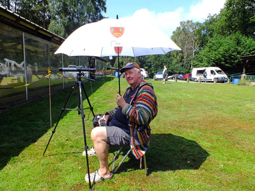 Photograph shows Lee Featherstone, back to shot-spotting duties, whilst soaking up the glorious sunshine which was thankfully in evidence during the afternoon session.  What a complete transformation of conditions ... umbrellas were now being used as parasols. Good old British weather!