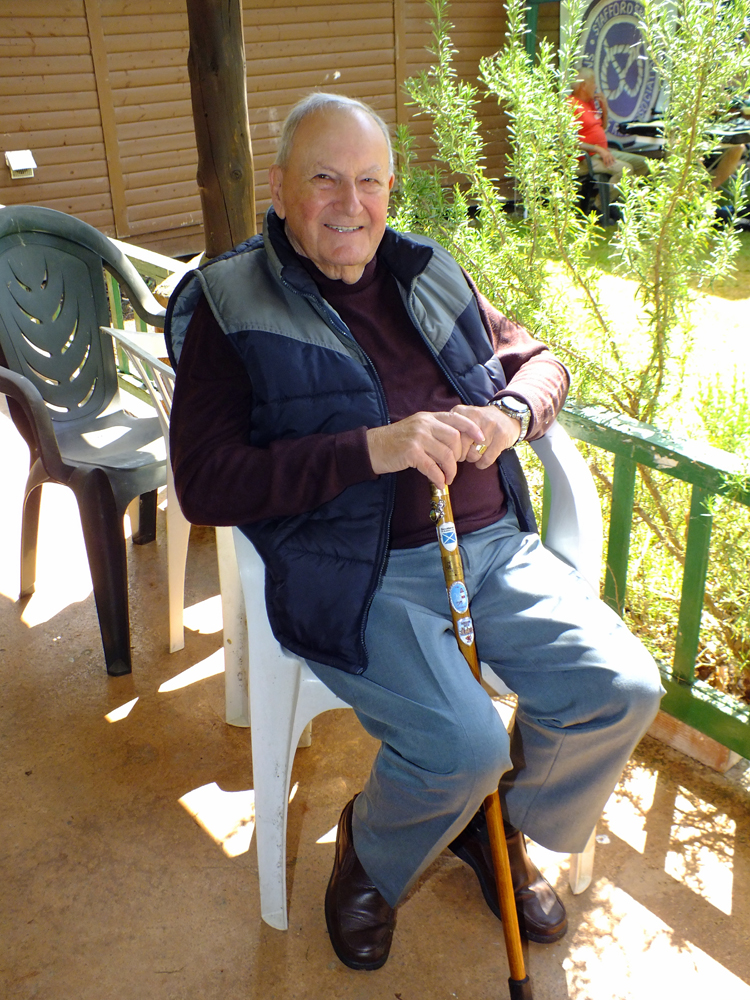 Photograph shows SSRA President - Mike B.P. Willcox - relaxing under the cover of the verandah, enjoying the view of the action.