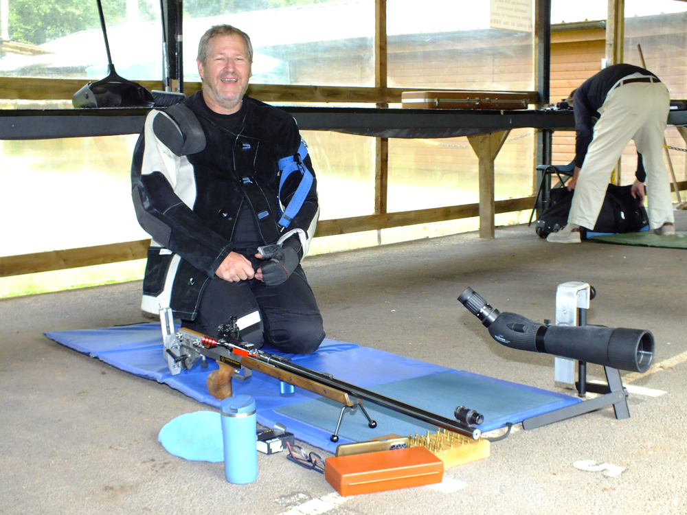 Photograph shows a totally relaxed Paul Baron on the firing line, waiting to start his final detail.