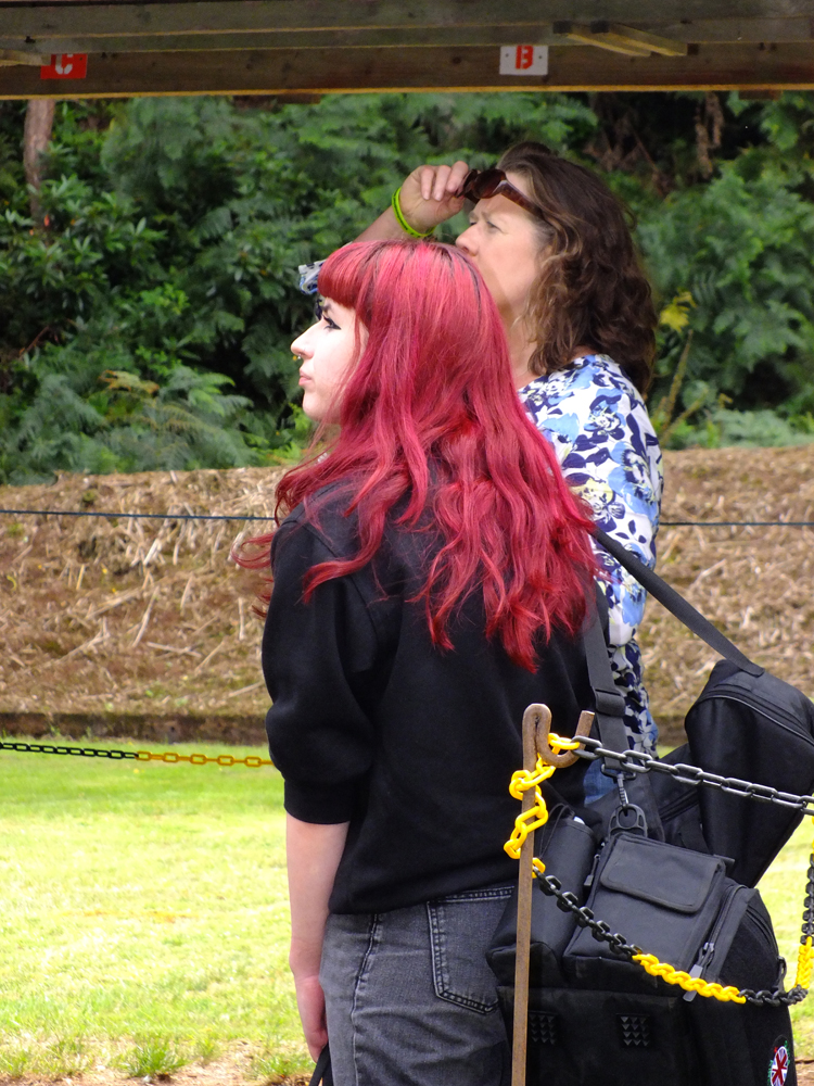 Photograph shows Olivia Kirkland (pictured left) and Dawn Hunt (pictured right) intently trying to spot something in the distance.