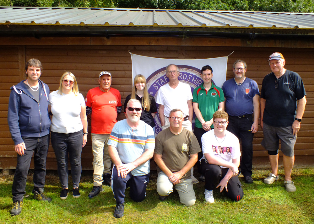 Photograph shows members of Rugeley Rifle Club whom kindly assembled for a group photograph.  Back row (left to right) are Nic Houghton, Emma Houghton, Graham Delaney, Phoebe Houghton, Vic Tyne, Richard Hemingway, Paul Baron, Lee Feathstone.  Front row (left to right) are Martyn Buttery, Dave Glover, Alex Buttery.