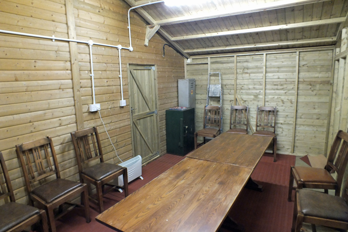 Photograph shows the anteroom interior - showing the door leading into the Airgun Range.