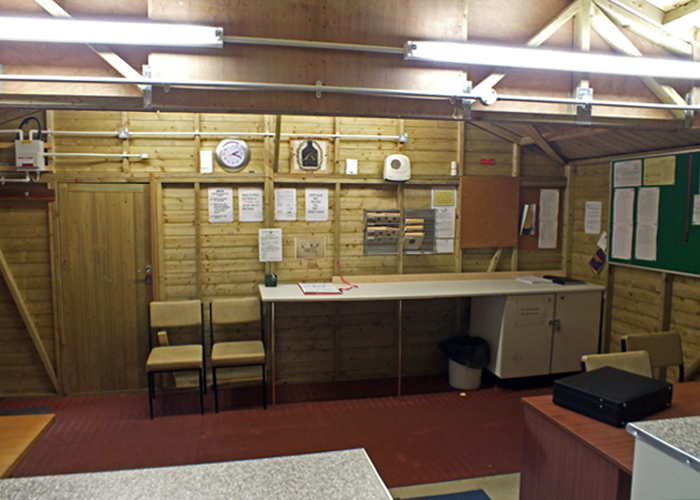 Photograph shows the Airgun Range interior - facing towards the rear of the range, with the door on the left leading to the anteroom.