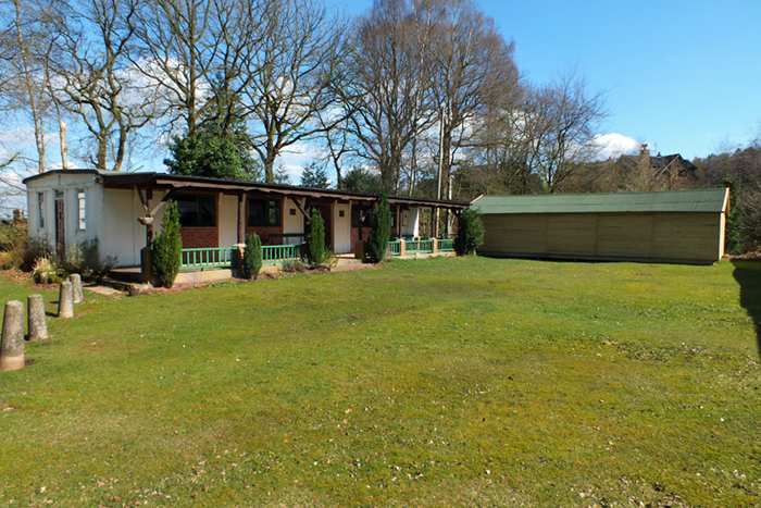 Photograph shows the airgun range situated to the right of the clubhouse.