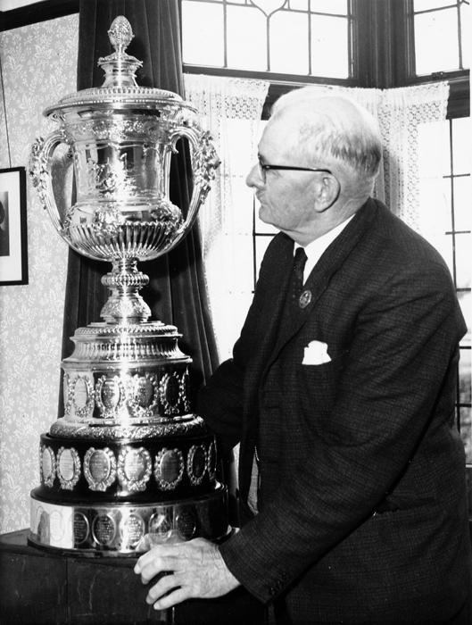 Photograph shows Edward John Chipperfield admiring the Queen Alexandra Cup.