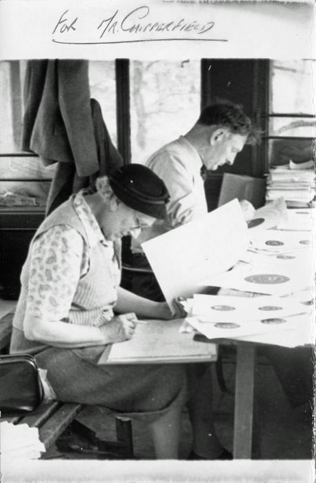 Photograph shows Mrs. Ethel Chipperfield - the wife of Edward John Chipperfield (pictured left) - scoring targets, assisted by W.B. Godwin (pictured right.)