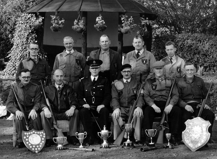 Photograph shows members of the Newcastle-under-Lyme Police Rifle Club Team, proudly displaying a plethora of trophies.  Edward John Chipperfield is pictured in the front row of the group wearing his beret.