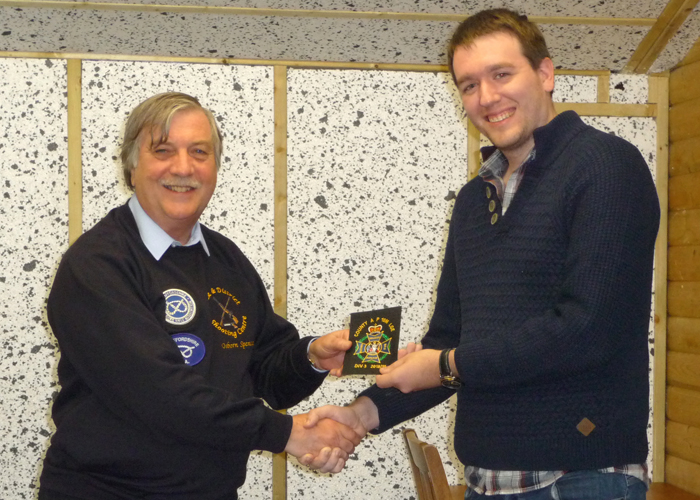 Photograph shows Osborn Spence - SSRA Airgun Secretary (pictured left) presenting the NSRA (680) Inter-County Air Pistol League - Division 3 - 2018/2019 - Winners Blazer Badge to Staffordshire Team Member Brendan Lewin (pictured right).