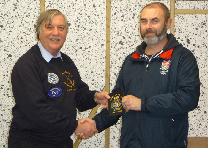 Photograph shows Osborn Spence - SSRA Airgun Secretary (pictured left) presenting the NSRA (680) Inter-County Air Pistol League - Division 3 - 2018/2019 - Winners Blazer Badge to Staffordshire Team Member Scott Turner (pictured right).