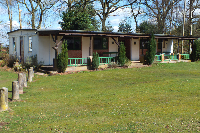 Photograph shows the picturesque clubhouse that sits proudly within the Chipperfield Ranges Complex.