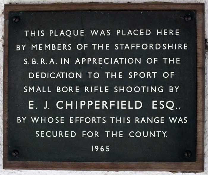 Photograph shows the plaque mounted on the clubhouse wall, dedicated to E.J. Chipperfield, to commemorate his efforts in securing the range for the county.