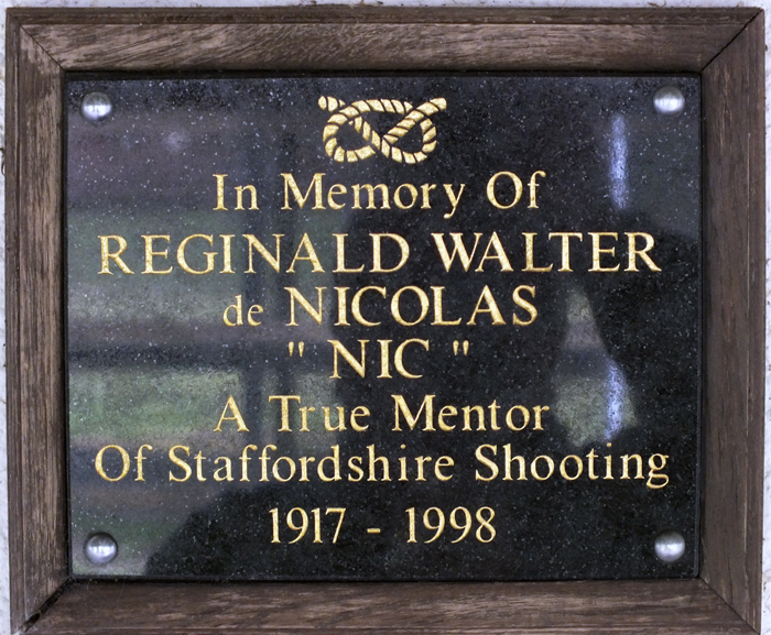 Photograph shows the plaque mounted on the clubhouse wall, dedicated to R.W. de Nicolas.