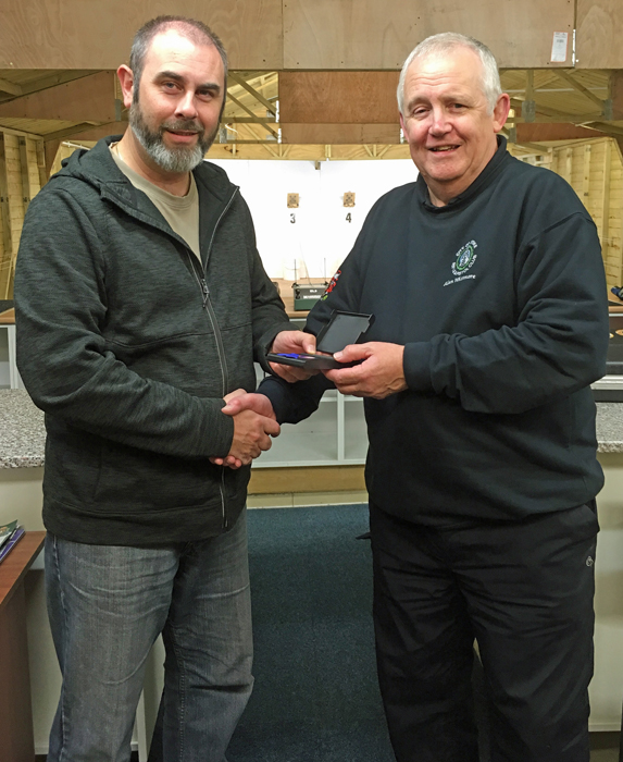 Photograph shows Scott Turner (pictured left) receiving the SSRA Individual Air Pistol League - Summer 2018 - 3rd Place Medal from Alan Whitmore (pictured right).