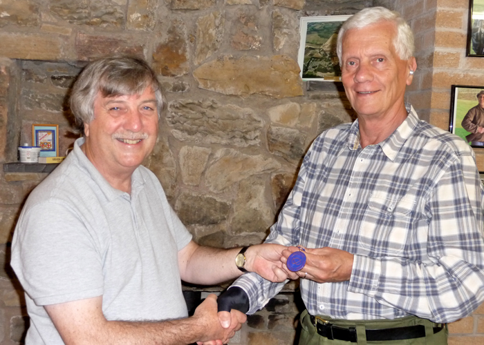 Photograph shows Osborn Spence - SSRA Airgun Secretary (left) presenting the SSRA Individual Air Rifle 'B' League - Summer 2019 - 3rd Place Medal to John Phillips of Leek (right).