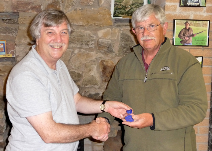 Photograph shows Osborn Spence - SSRA Airgun Secretary (left) presenting the SSRA Individual Air Pistol 'B' League - Summer 2019 - 3rd Place Medal to Mike Peacock of Leek (right).