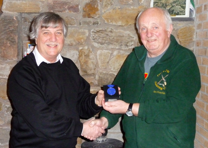 Photograph shows Osborn Spence - SSRA Airgun Secretary (pictured left) presenting the SSRA Individual Air Pistol 'B' League - Winter 2019/2020 - 2nd Place Medal to Ian Hutchinson of Leek and District Shooting Centre (pictured right).