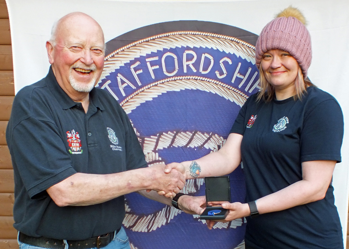 Photograph shows Steph Reynolds of City of Stoke RPC (pictured right) receiving her SSRA Individual Air Rifle "A" League - 1st Place Medal from Mike Baxter of City of Stoke RPC (pictured left).