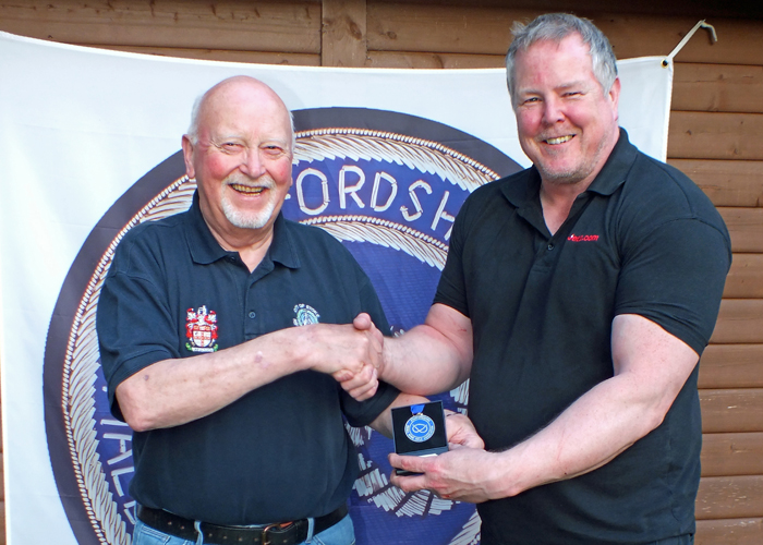 Photograph shows Dom Paskin of City of Stoke RPC (pictured right) receiving his SSRA Individual Air Pistol League - 1st Place Medal from Mike Baxter of City of Stoke RPC (pictured left).