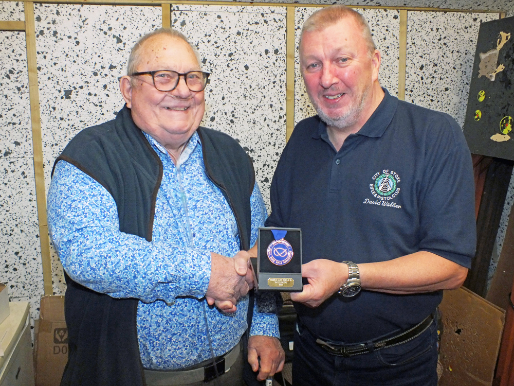 Photograph shows Zed Pazio of City of Stoke RPC (pictured left) receiving his SSRA Individual Air Rifle - B League - Summer 2025 - 3rd Place Medal from Dave Walker of City of Stoke RPC (pictured left).