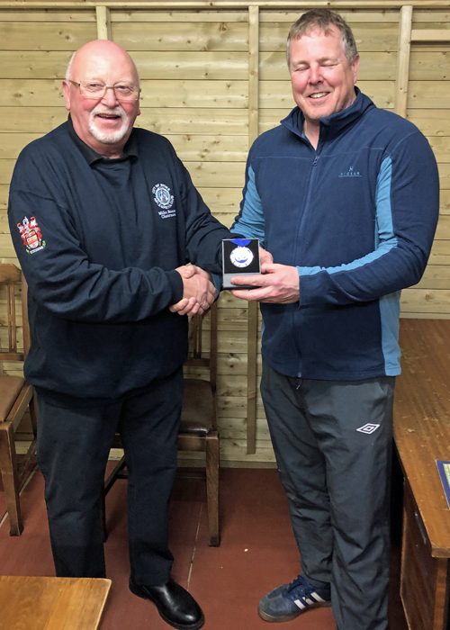 Photograph shows City of Stoke Chairman, Mike Baxter (pictured left), presenting Dom Paskin (pictured right) with his SSRA Individual Air Pistol 'B' League - 2nd Place Medal.