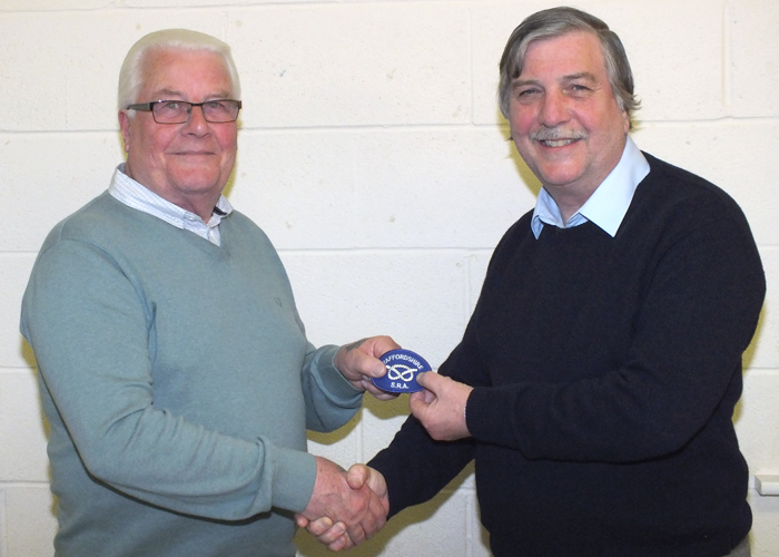 Photograph shows Bill Hulley (pictured left) receiving his Staffordshire County Badge from SSRA Airgun Secretary, Osborn Spence (pictured right).