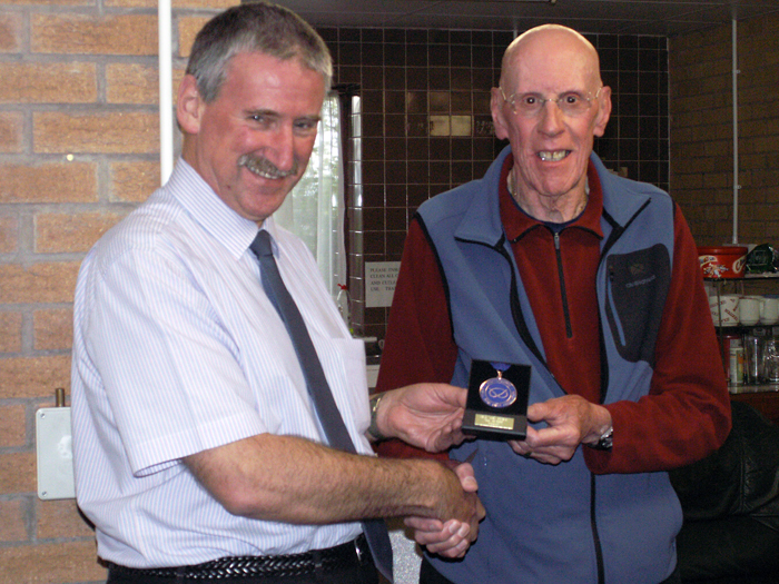 Photograph shows SSRA Vice-President - Robert Knott (pictured right), presenting Leek shooter Martin Jupp (pictured left) with his medal for finishing in 3rd place in the SSRA Air Section - Individual Air Pistol League - Winter 2014/2015 Competition.