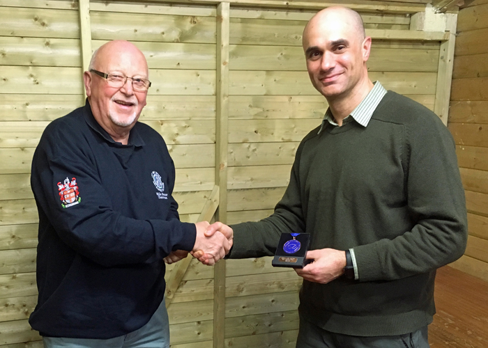 Photograph shows City of Stoke RPC Chairman - Mike Baxter (pictured left) presenting Theo Kyriacou (pictured right) with his SSRA Air Pistol Individual League 3rd Place Medal.