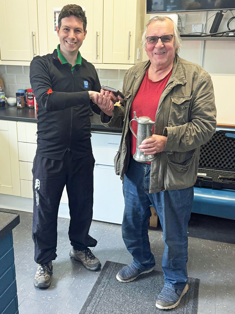 Photograph shows Ian Abbotts of City of Stoke RPC (pictured right) receiving the Veterans Short Range Championship Tankard from Richard Hemingway (pictured left).