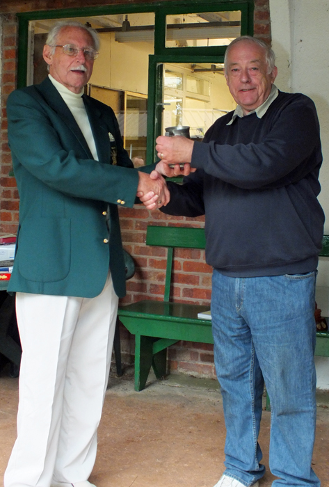Photograph shows D. Bayley, pictured right, receiving on behalf of the City of Birmingham Rifle Club, the Astor Tankard from SSRA President - Major (Retired) Peter Martin, MBE.