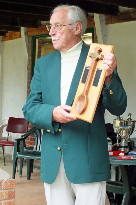 Photograph shows SSRA President - Major (Retired) Peter Martin, MBE., announcing I. Leigh as being the latest recipient of The Wooden Spoon.