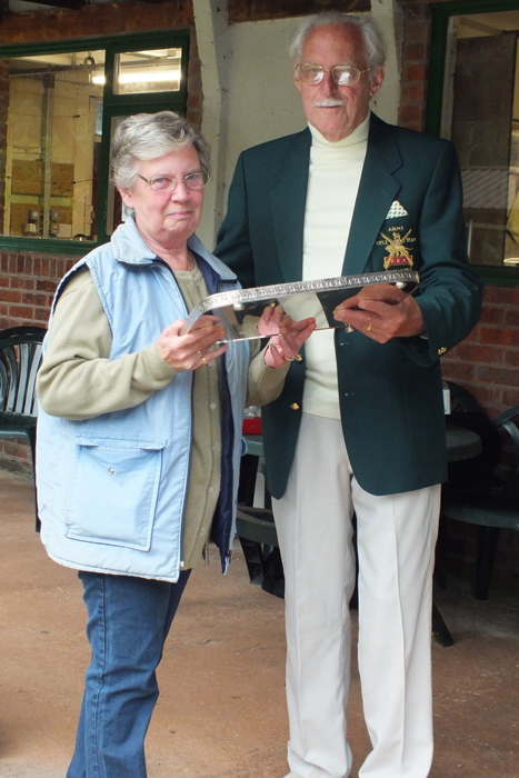 Photograph shows Mrs M. Bayley (pictured left) receiving the James Beattie Tray from SSRA President, Major (Retired) Peter Martin, MBE (pictured right).